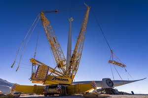 Lattice boom crane erecting a wind turbine